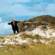 Image for article titled Biden Tries To Hammer Board Into Sand To Kick Off Post-Hurricane Rebuilding Efforts